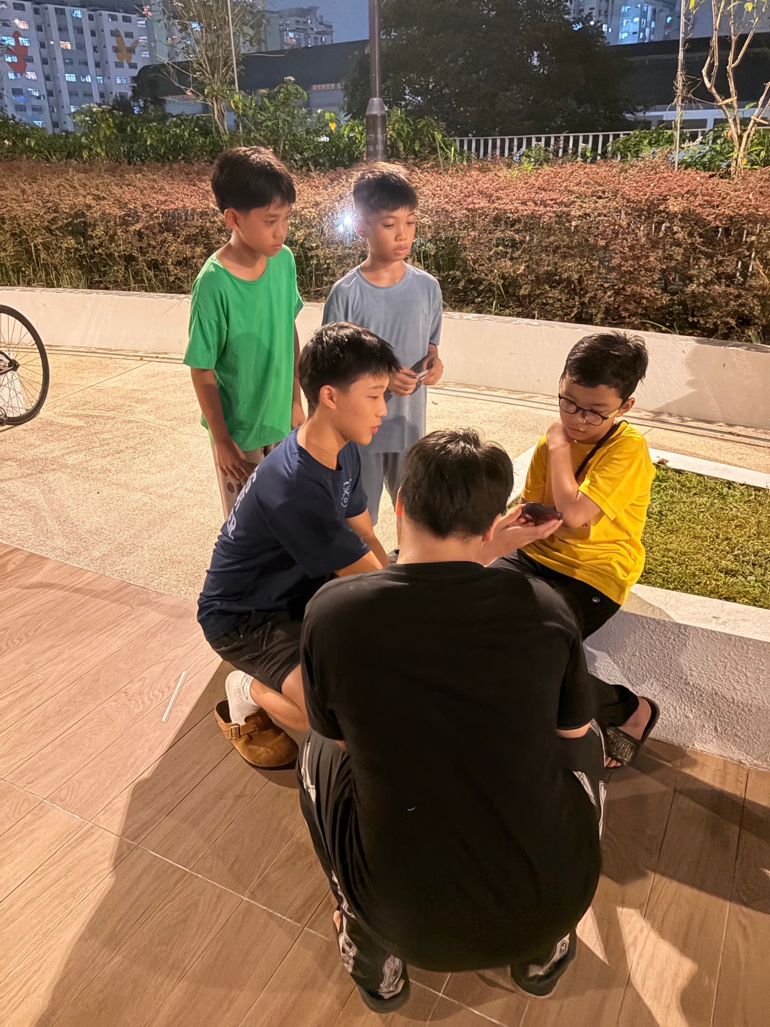 Young AstroYouth members looking at a stargazing app