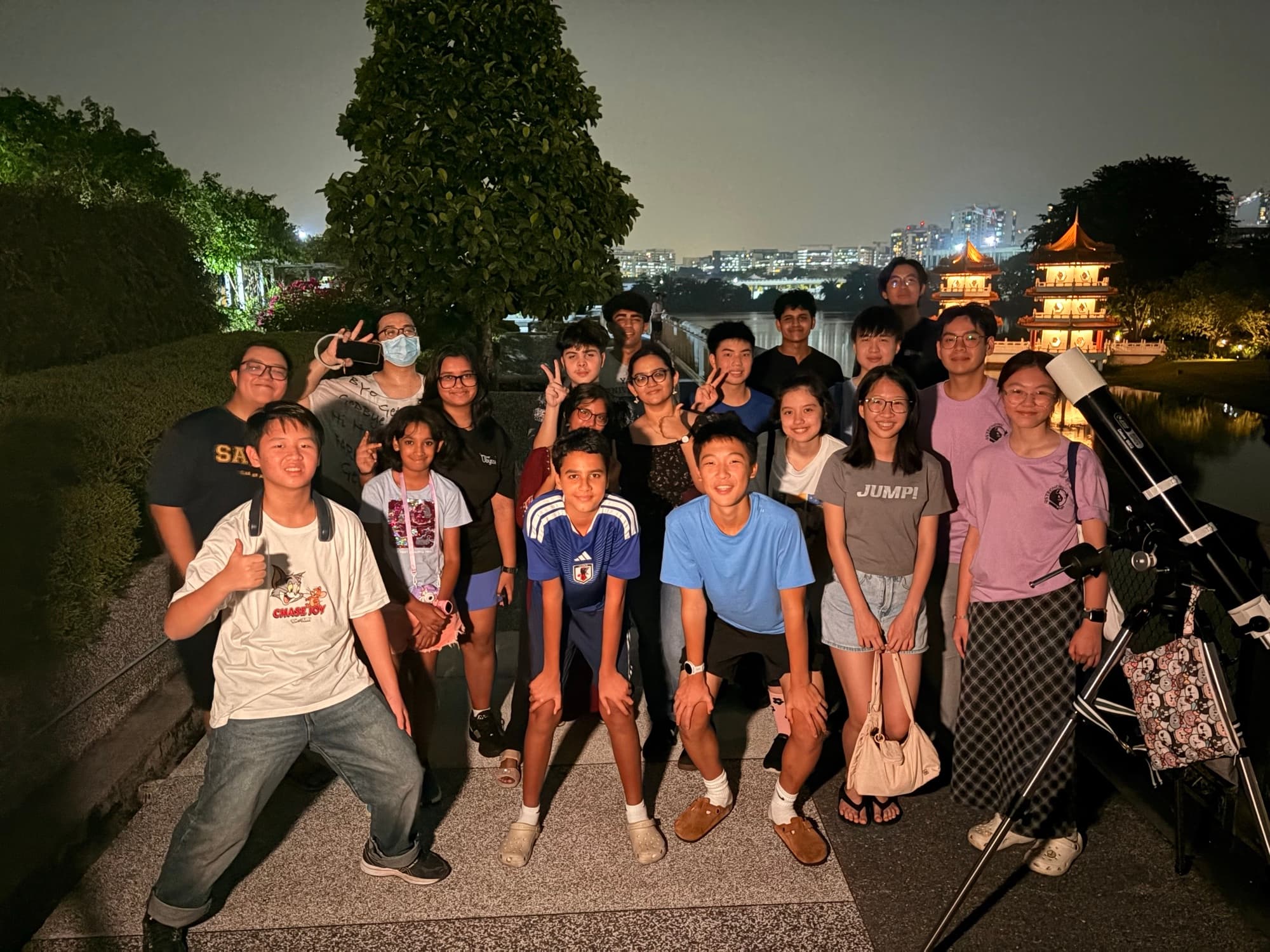 AstroYouth members at a Community Astronomy Session with a telescope
