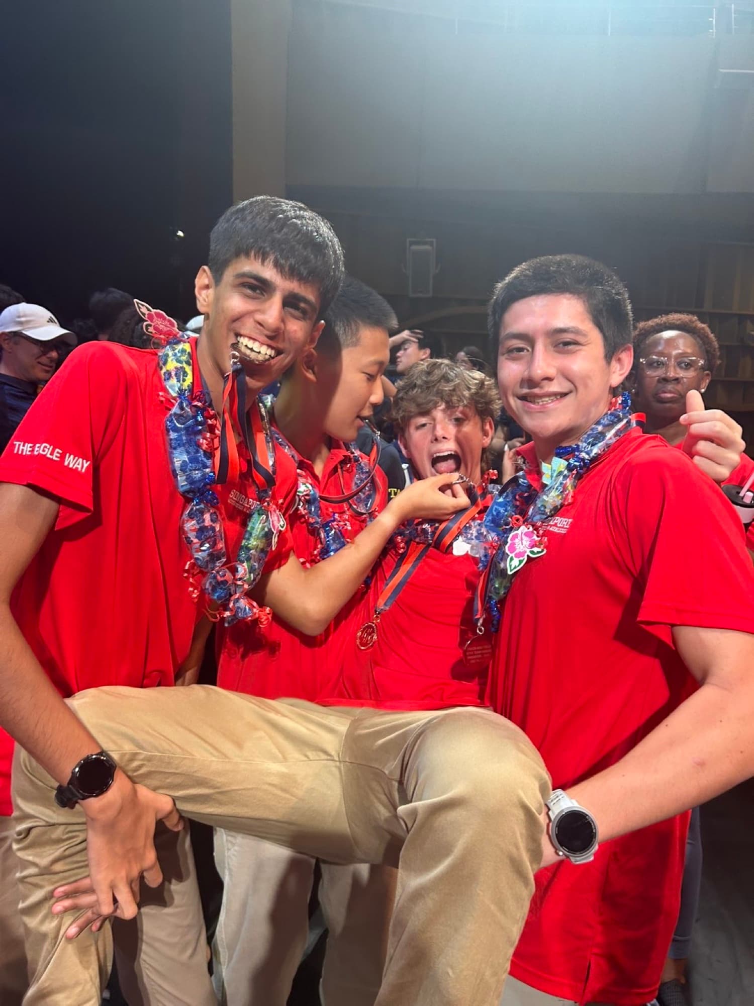 Sam celebrating with teammates after a race